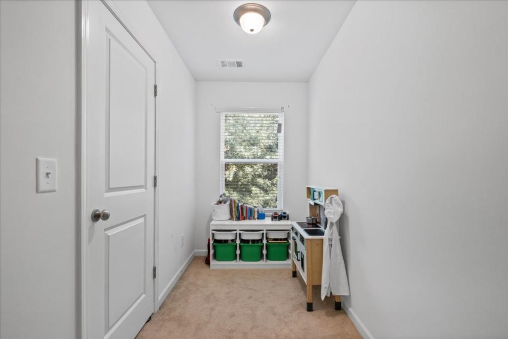 4998 Longview Walk Decatur, GA 30035 - Photo 25 of 29 a bedroom with a bed and a window