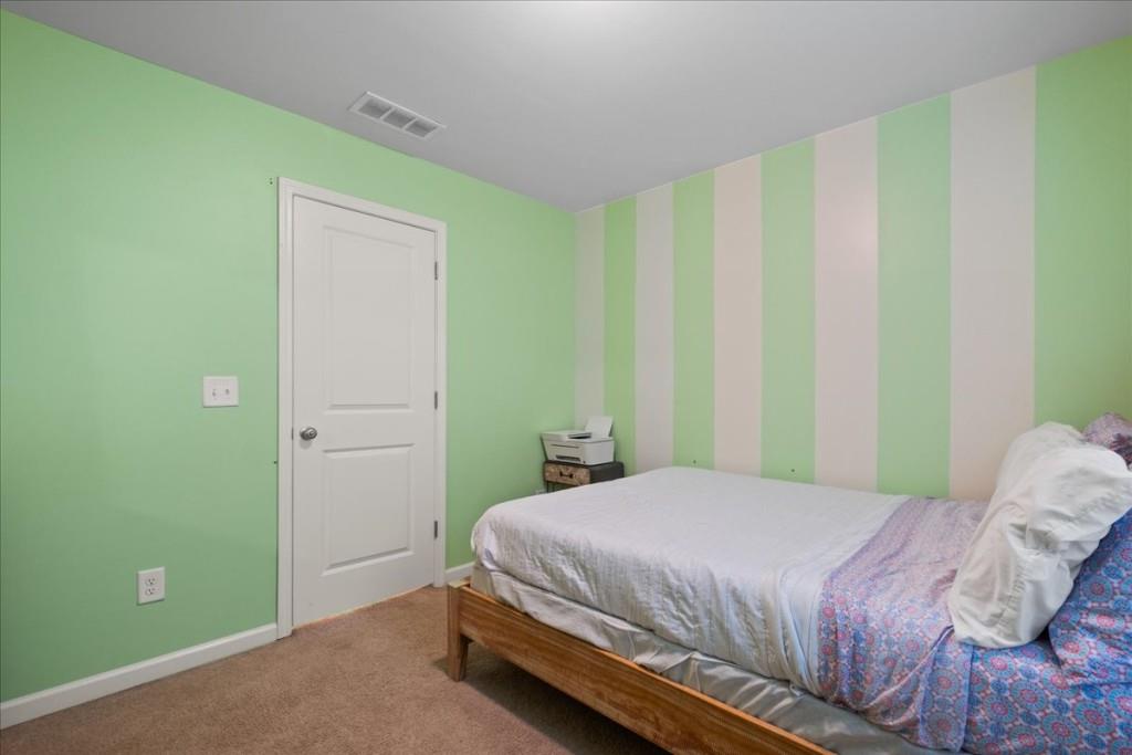 4998 Longview Walk Decatur, GA 30035 - Photo 28 of 29 a bedroom with a bed and a window