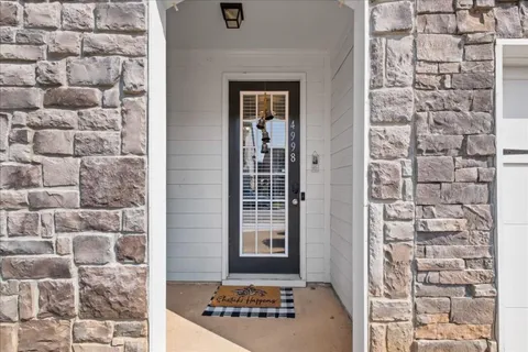 a view of a door and a window