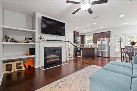 a living room with furniture fireplace and flat screen tv
