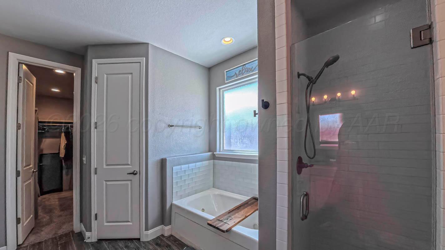 8903 Canton Court Amarillo, TX 79119 - Photo 17 of 26 a bathroom with a shower