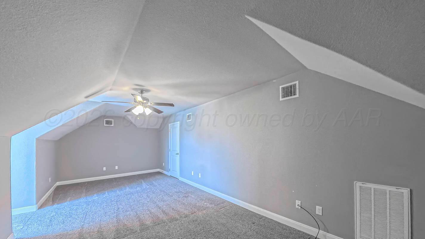 8903 Canton Court Amarillo, TX 79119 - Photo 20 of 26 a view of a chandelier fan and entryway