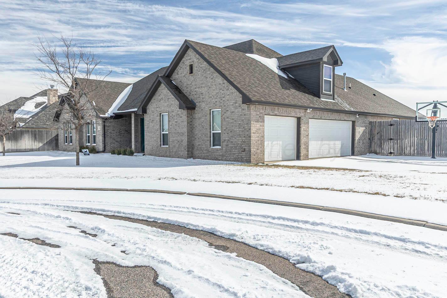 8903 Canton Court Amarillo, TX 79119 - Photo 2 of 26 front view of a house with a bench