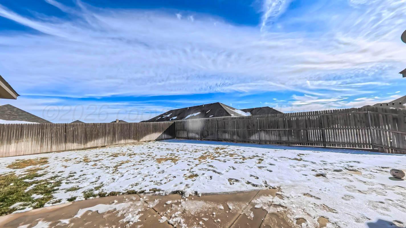 8903 Canton Court Amarillo, TX 79119 - Photo 25 of 26 a view of yard with a snow in the yard
