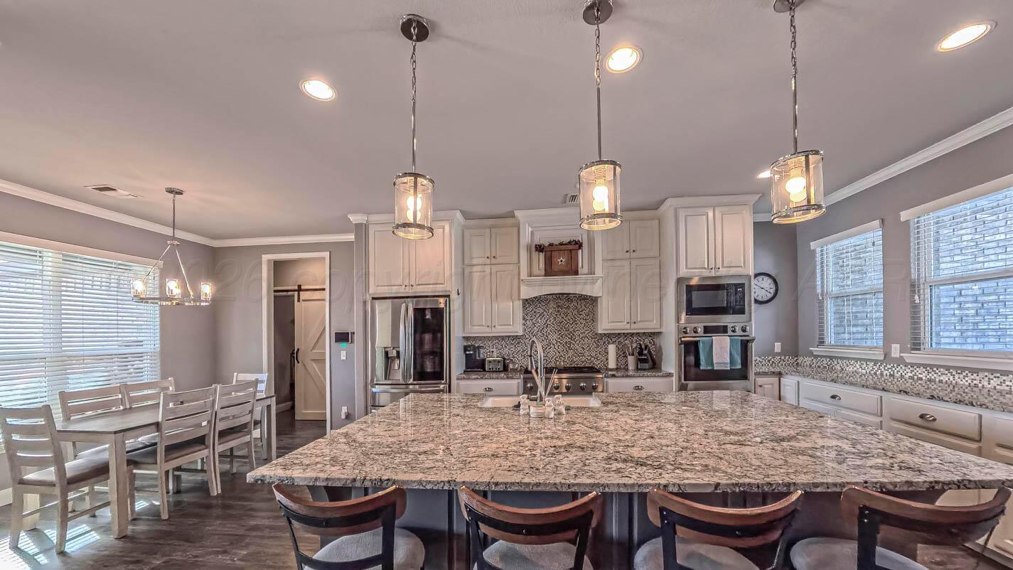 8903 Canton Court Amarillo, TX 79119 - Photo 3 of 26 a kitchen with a table and chairs in it