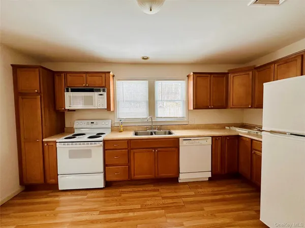 a kitchen with a stove a sink and a refrigerator