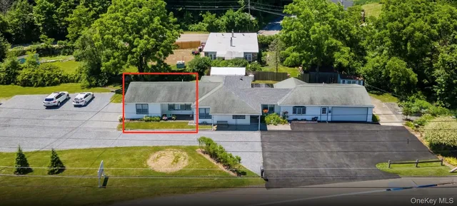 an aerial view of a house with swimming pool