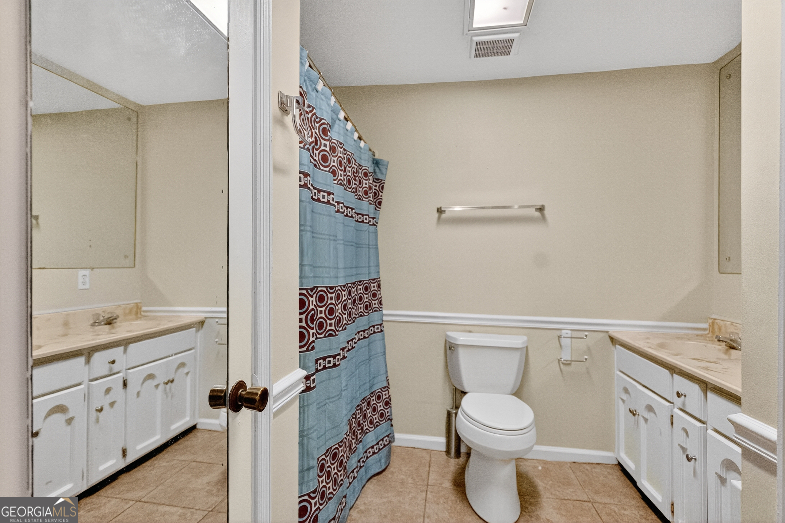 709 Vernon Ferry Road LaGrange, GA 30240 - Photo 15 of 27 a bathroom with a toilet a sink and a shower
