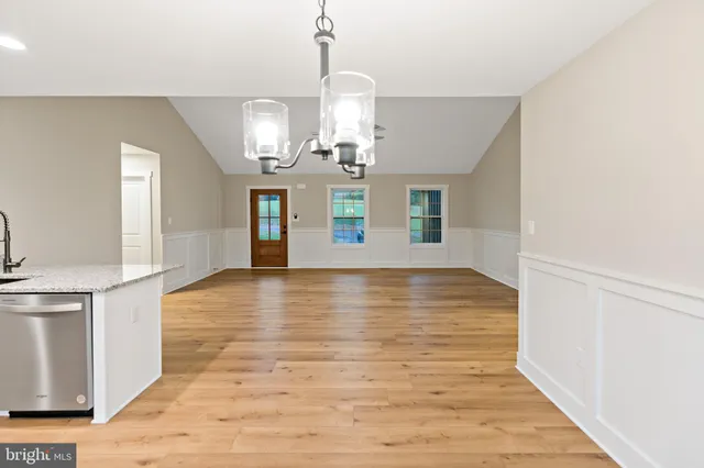 a view of a kitchen with wooden floor