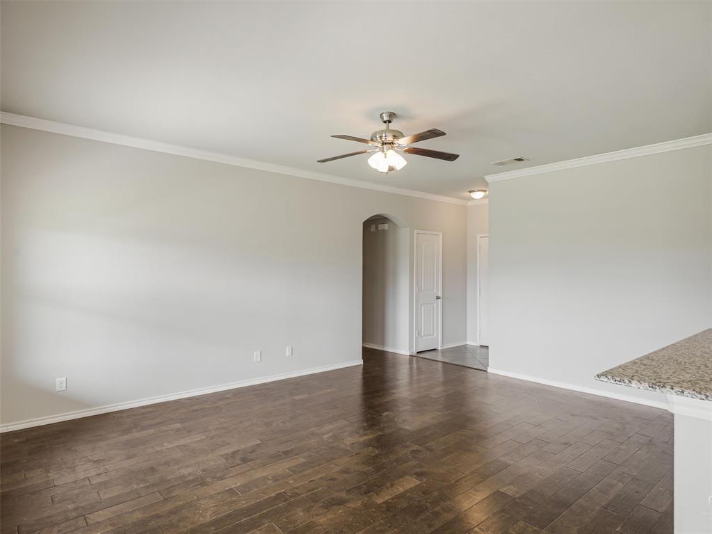 132 County Road 4213 Decatur, TX 76234 - Photo 4 of 27 a view of an empty room with a chandelier fan