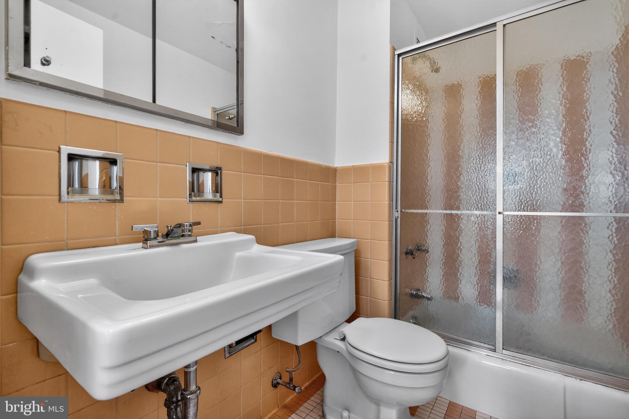 2475 Virginia Avenue Northwest, Unit 429 Washington, DC 20037 - Photo 16 of 35 a bathroom with a sink toilet and shower