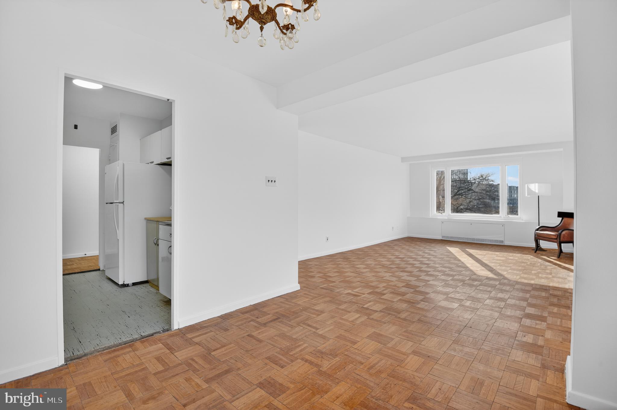 2475 Virginia Avenue Northwest, Unit 429 Washington, DC 20037 - Photo 17 of 27 a bedroom with a bed and a table