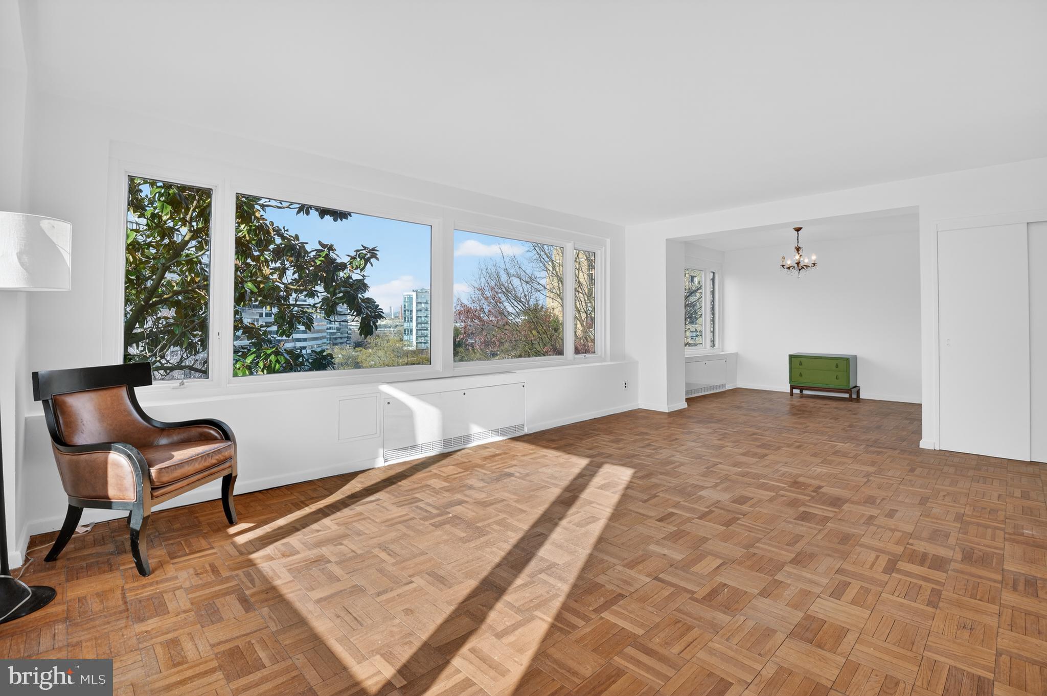 2475 Virginia Avenue Northwest, Unit 429 Washington, DC 20037 - Photo 20 of 27 a bedroom with furniture and a large window