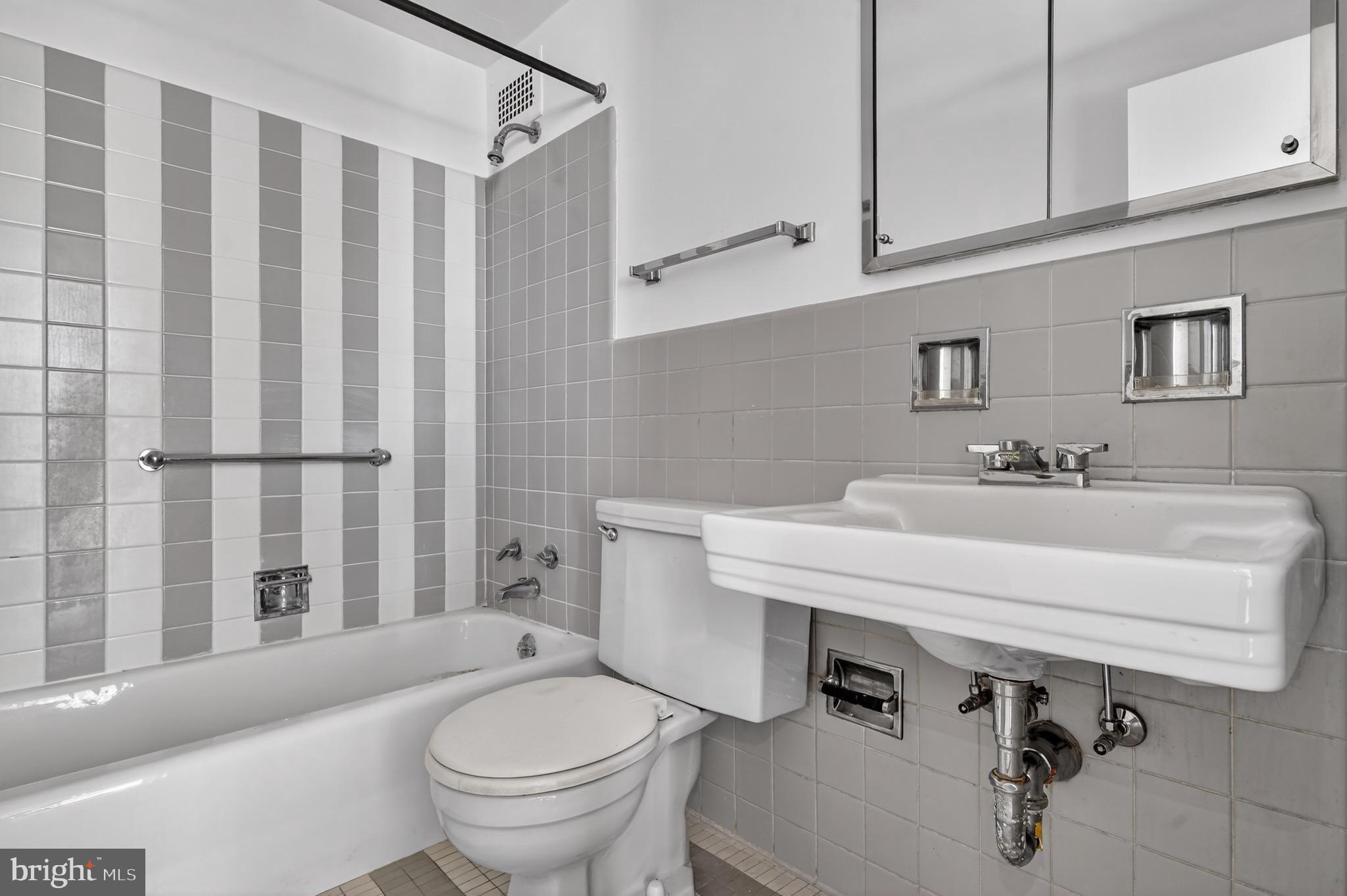2475 Virginia Avenue Northwest, Unit 429 Washington, DC 20037 - Photo 22 of 35 a bathroom with a sink a toilet and a bathtub