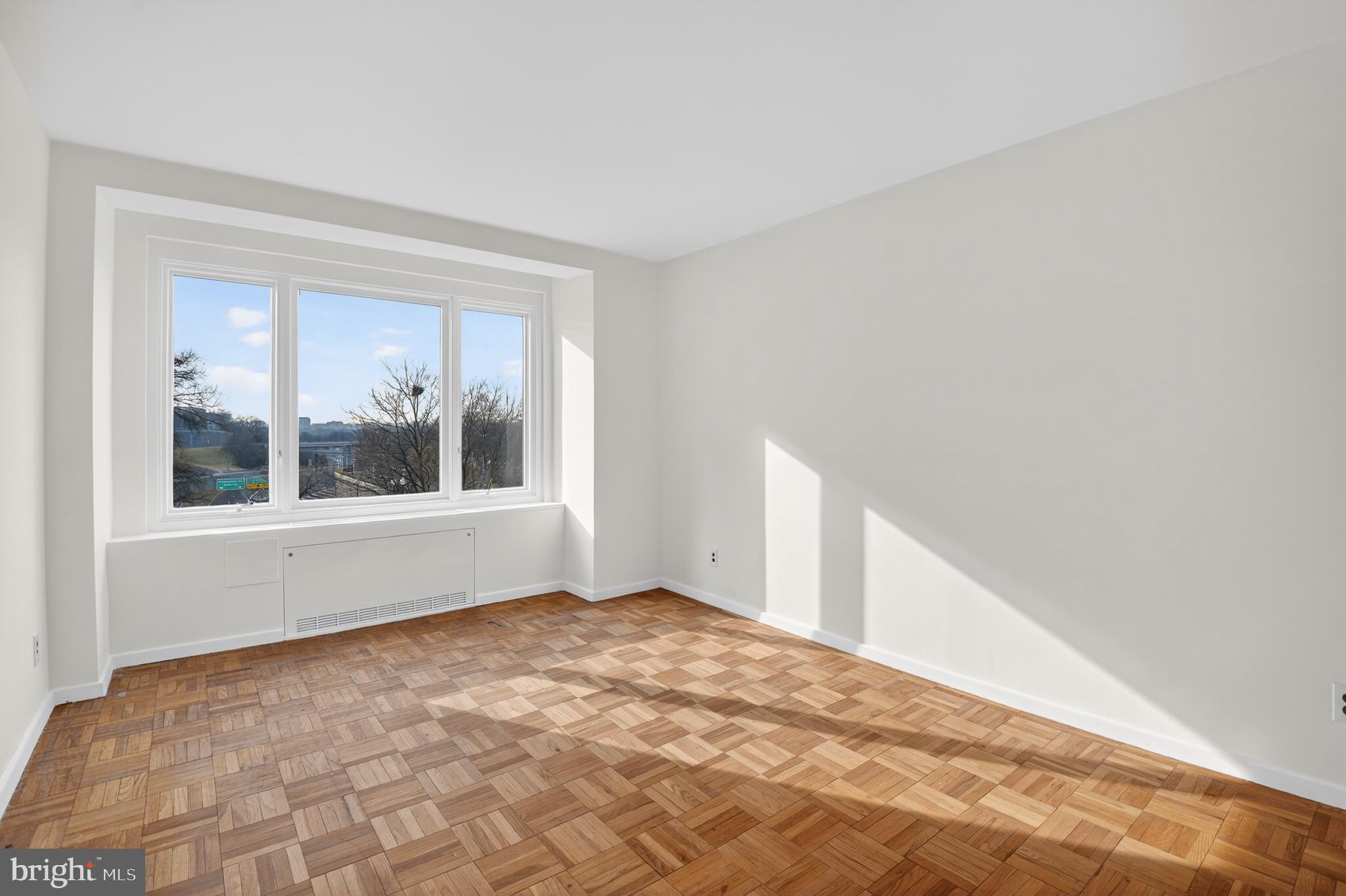2475 Virginia Avenue Northwest, Unit 429 Washington, DC 20037 - Photo 4 of 27 a view of empty room with window