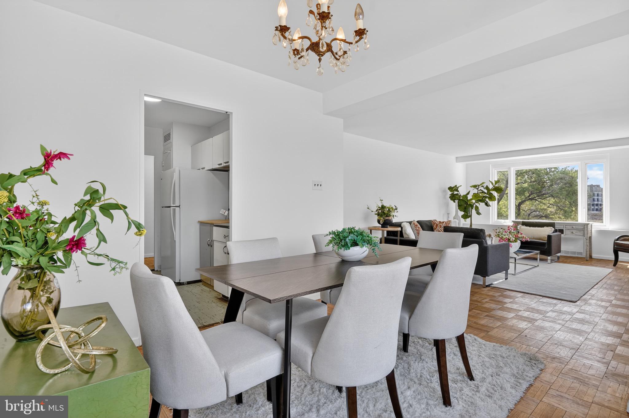 2475 Virginia Avenue Northwest, Unit 429 Washington, DC 20037 - Photo 7 of 35 a view of a dining room with furniture window and wooden floor