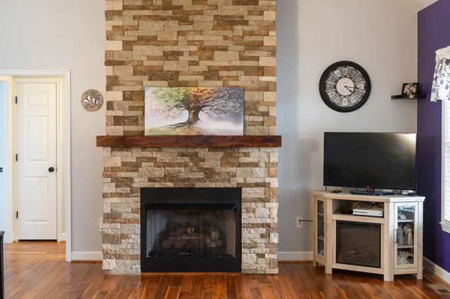 a kitchen with a stove and a white cabinets