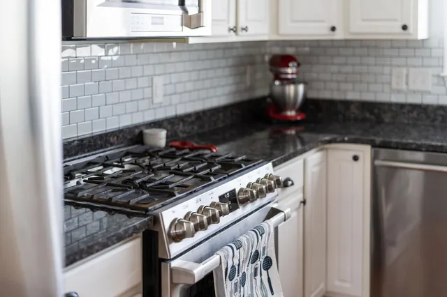 a bathroom with a bathtub a mirror and vanity