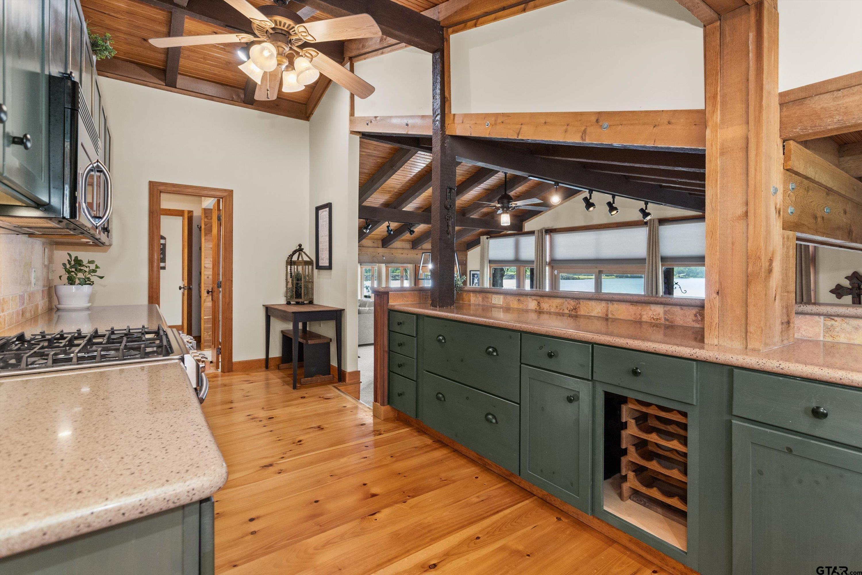 129 Tejas Trail Grapeland, TX 75844 - Photo 17 of 47 a kitchen with stainless steel appliances granite countertop a stove and cabinets