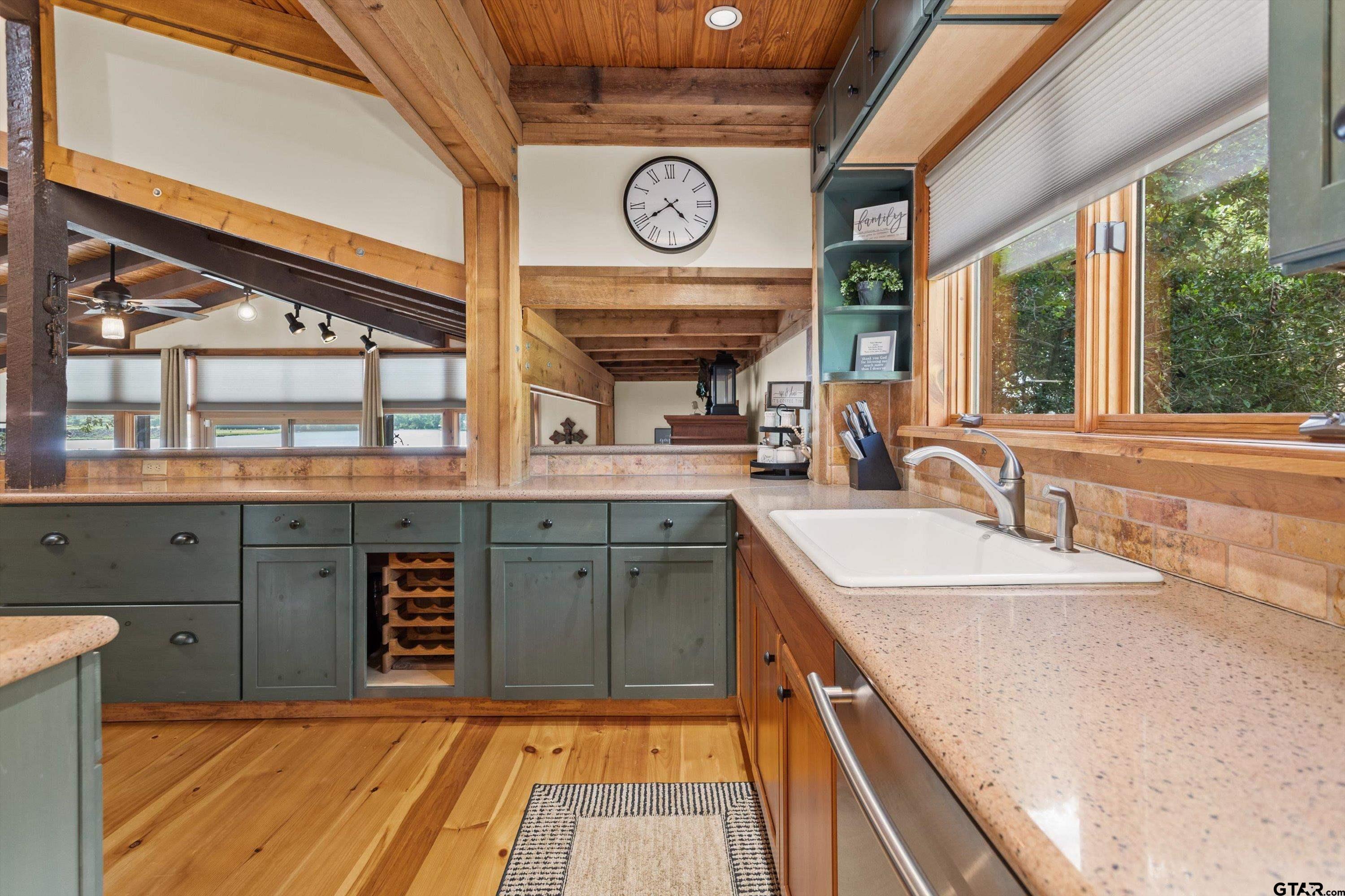 129 Tejas Trail Grapeland, TX 75844 - Photo 19 of 47 a view of a kitchen with a sink and a large window