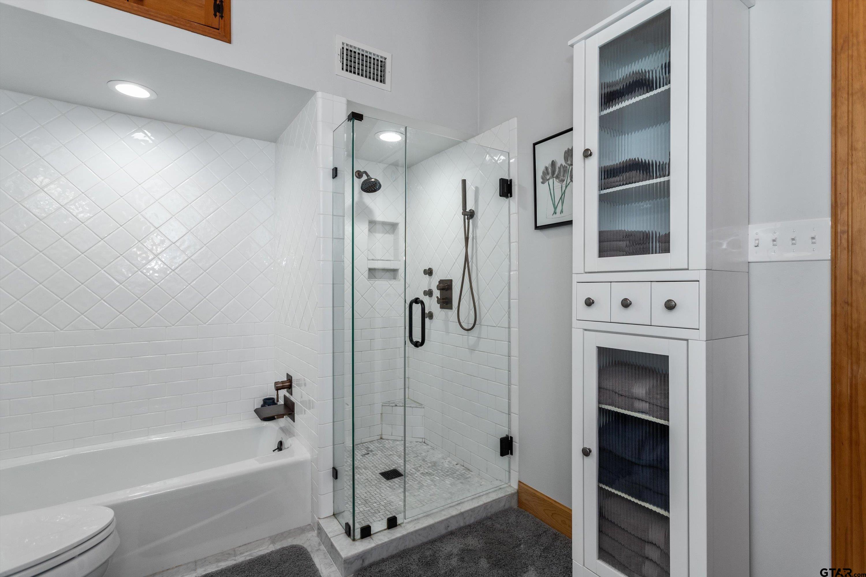 129 Tejas Trail Grapeland, TX 75844 - Photo 25 of 47 a bathroom with a bathtub and a shower