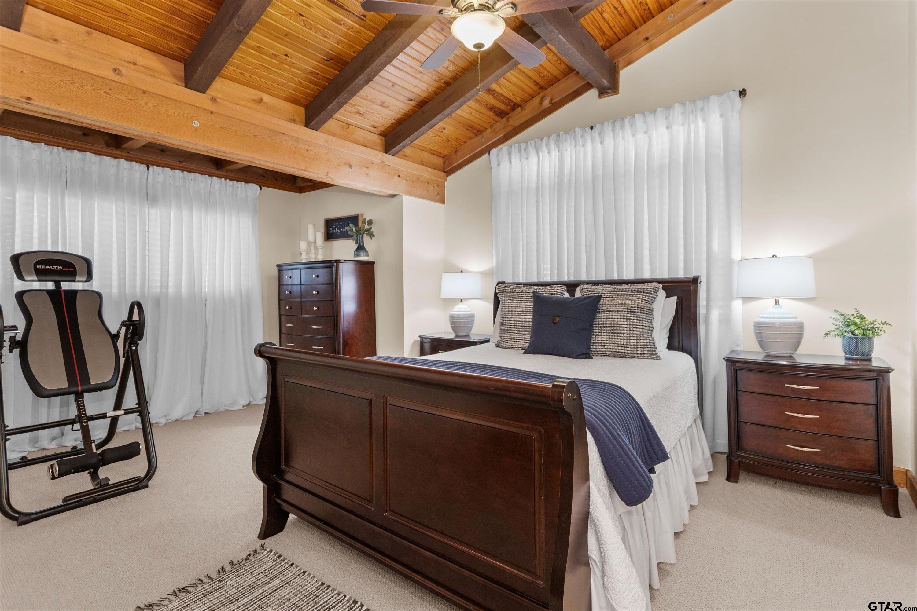 129 Tejas Trail Grapeland, TX 75844 - Photo 30 of 47 a bed room with a bed and a chair