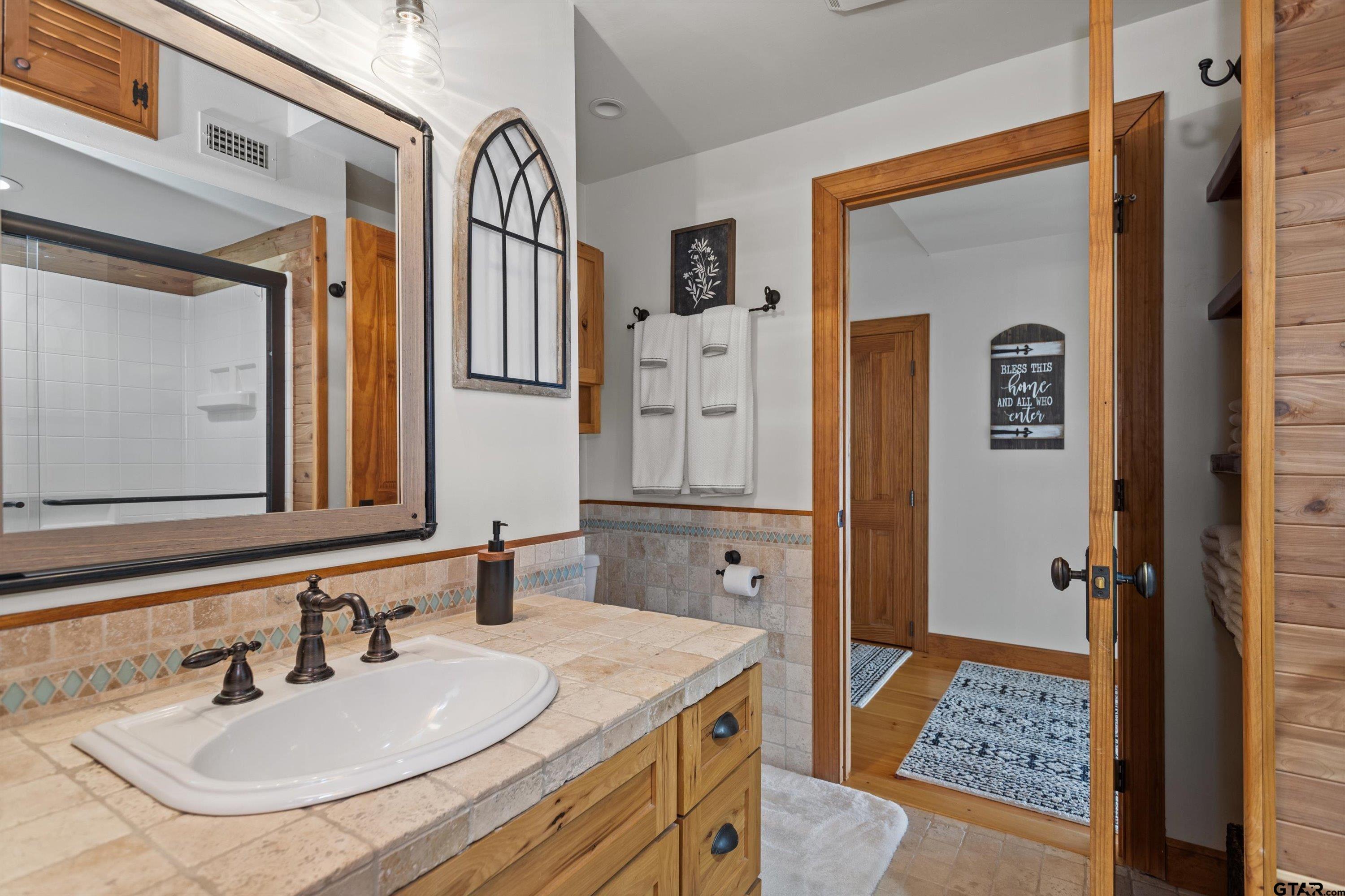129 Tejas Trail Grapeland, TX 75844 - Photo 31 of 47 a bathroom with a sink and a mirror