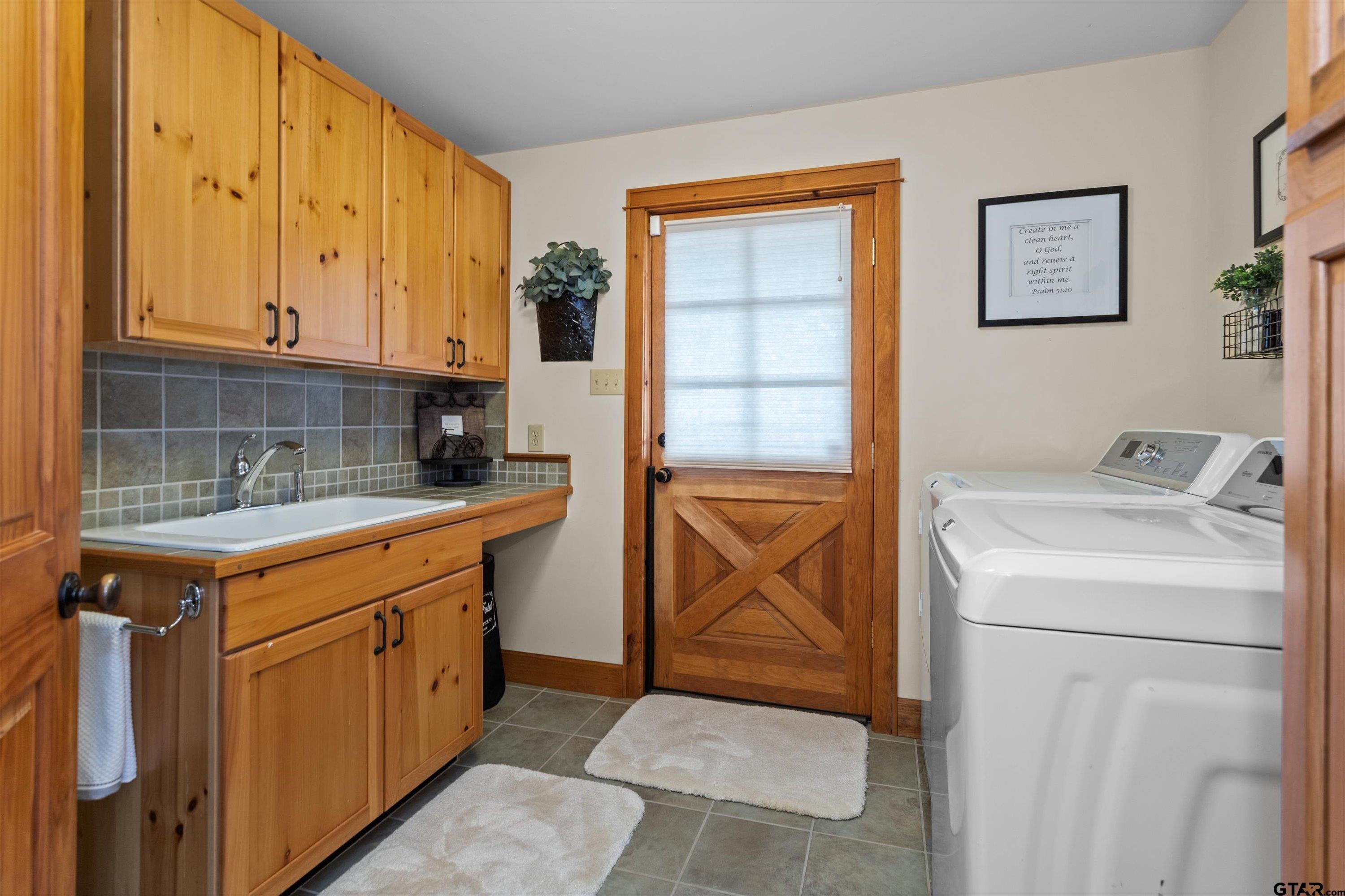 129 Tejas Trail Grapeland, TX 75844 - Photo 37 of 47 a utility room with dryer and washer