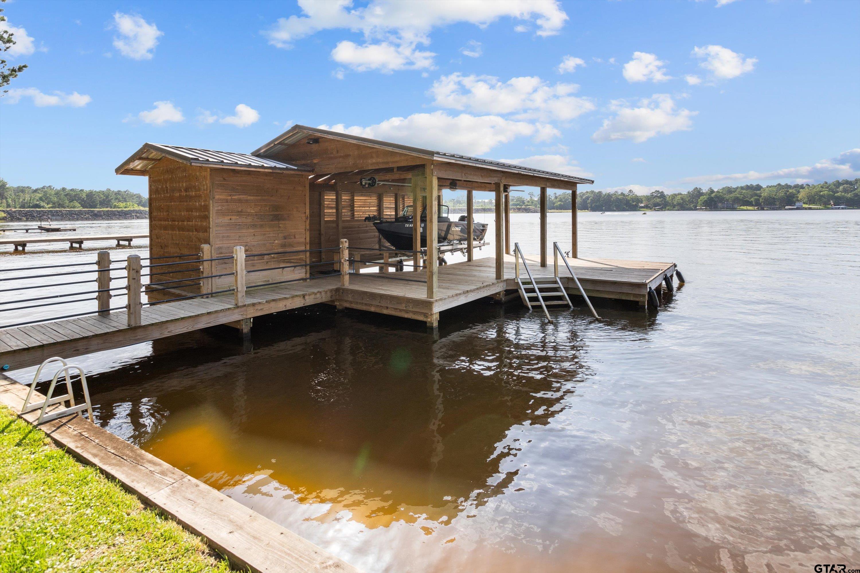 129 Tejas Trail Grapeland, TX 75844 - Photo 39 of 47 a view of a swimming pool with a lounge chairs