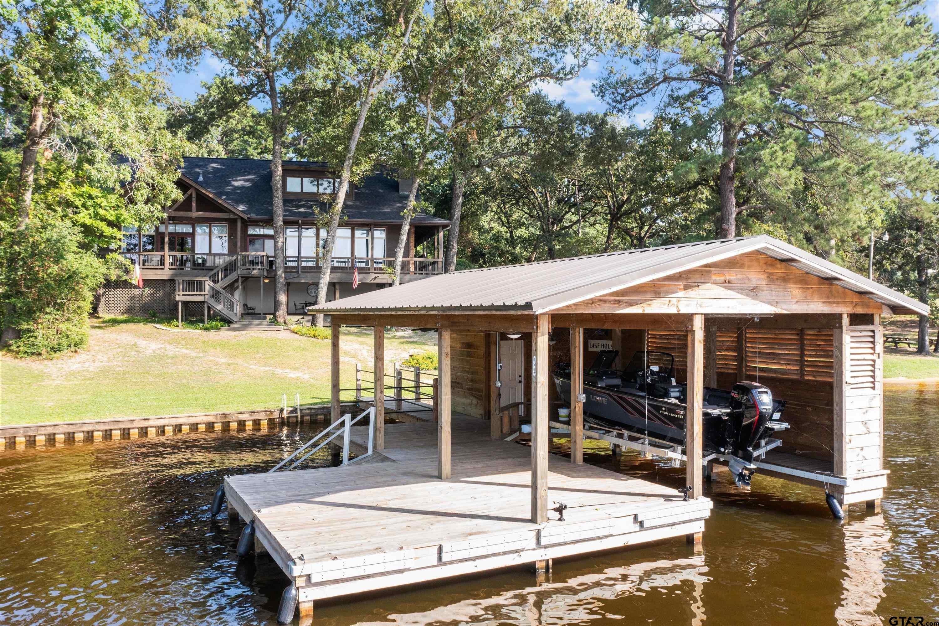 129 Tejas Trail Grapeland, TX 75844 - Photo 40 of 47 a view of a swimming pool with chair and tables
