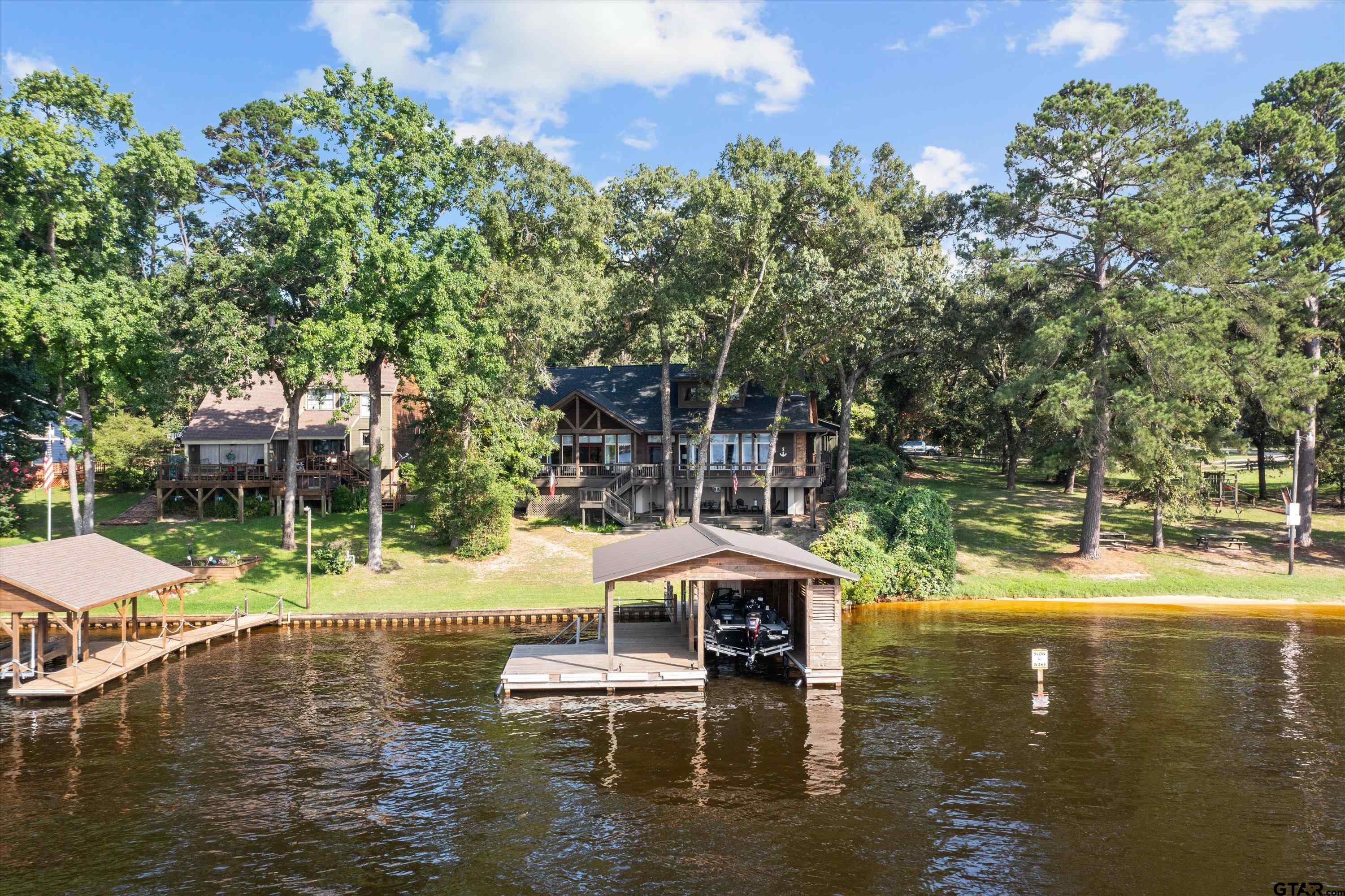 129 Tejas Trail Grapeland, TX 75844 - Photo 4 of 47 a small pool with lots of tress in the background