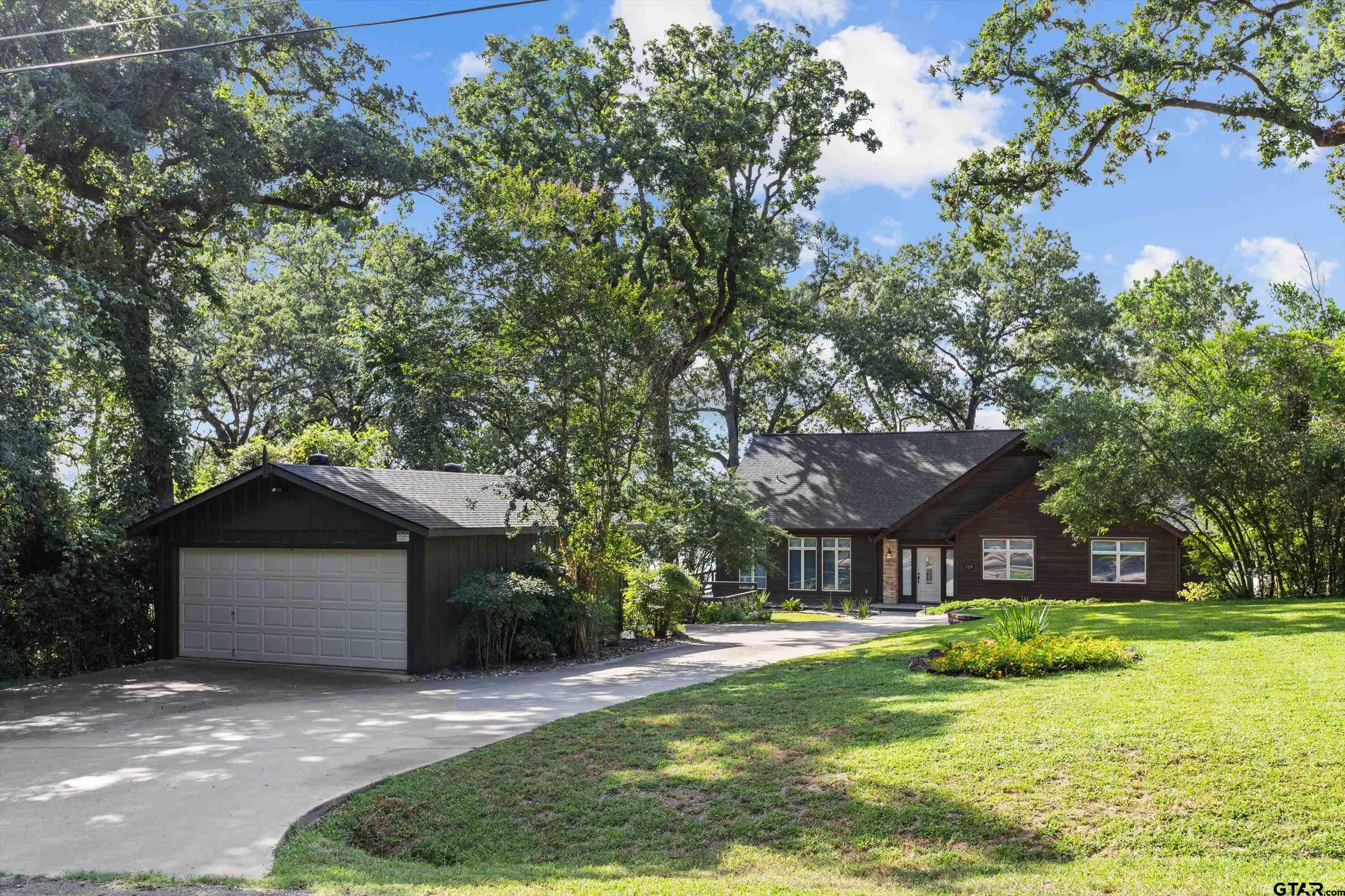 129 Tejas Trail Grapeland, TX 75844 - Photo 46 of 47 a front view of a house with a yard