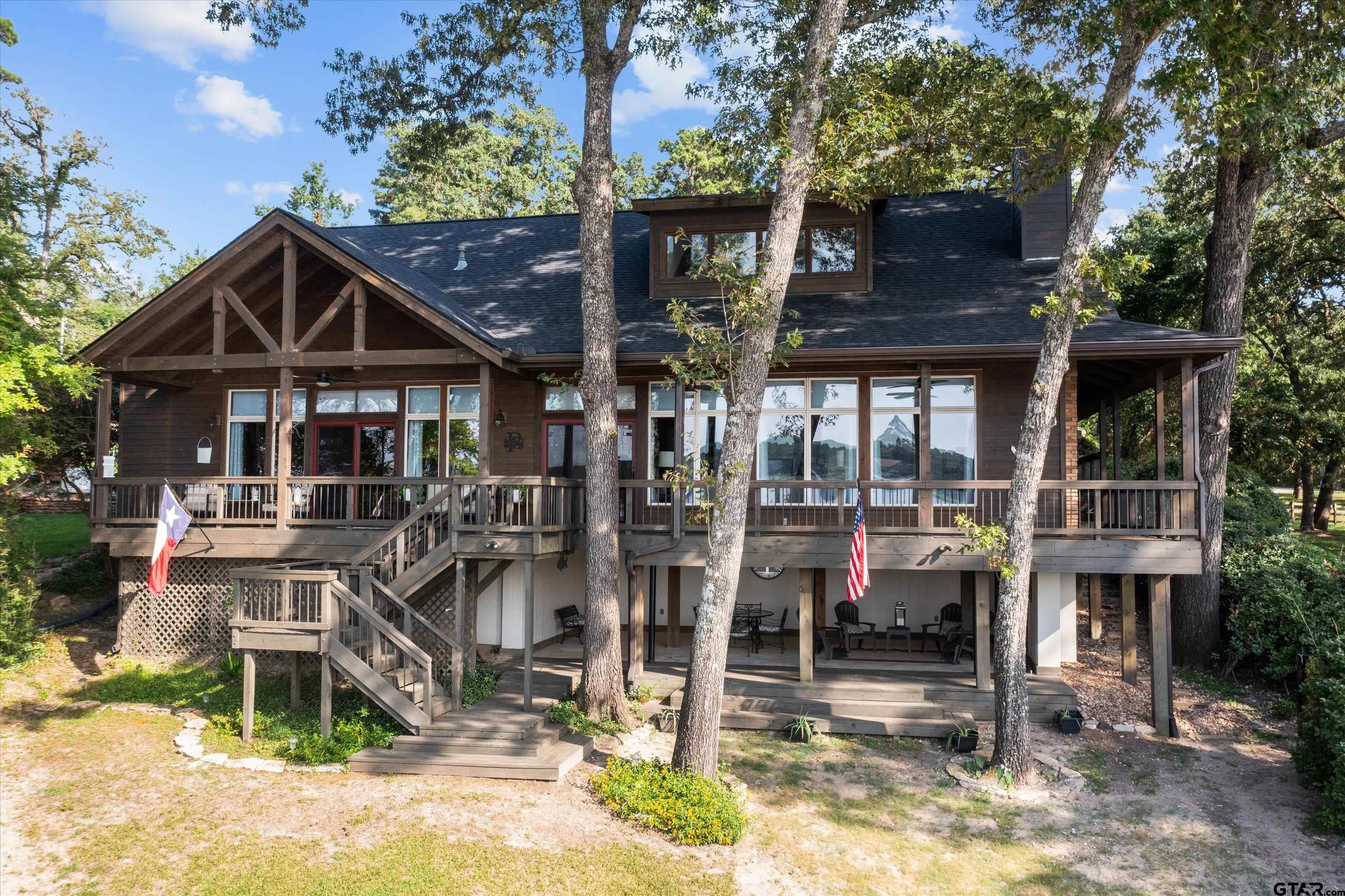 129 Tejas Trail Grapeland, TX 75844 - Photo 5 of 47 a front view of a house with swimming pool