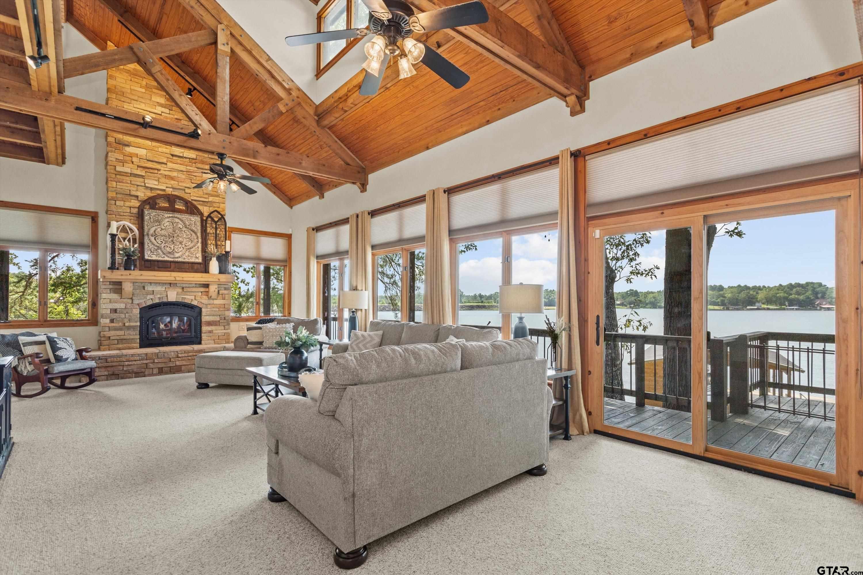 129 Tejas Trail Grapeland, TX 75844 - Photo 8 of 47 a living room with furniture large fireplace and a large window