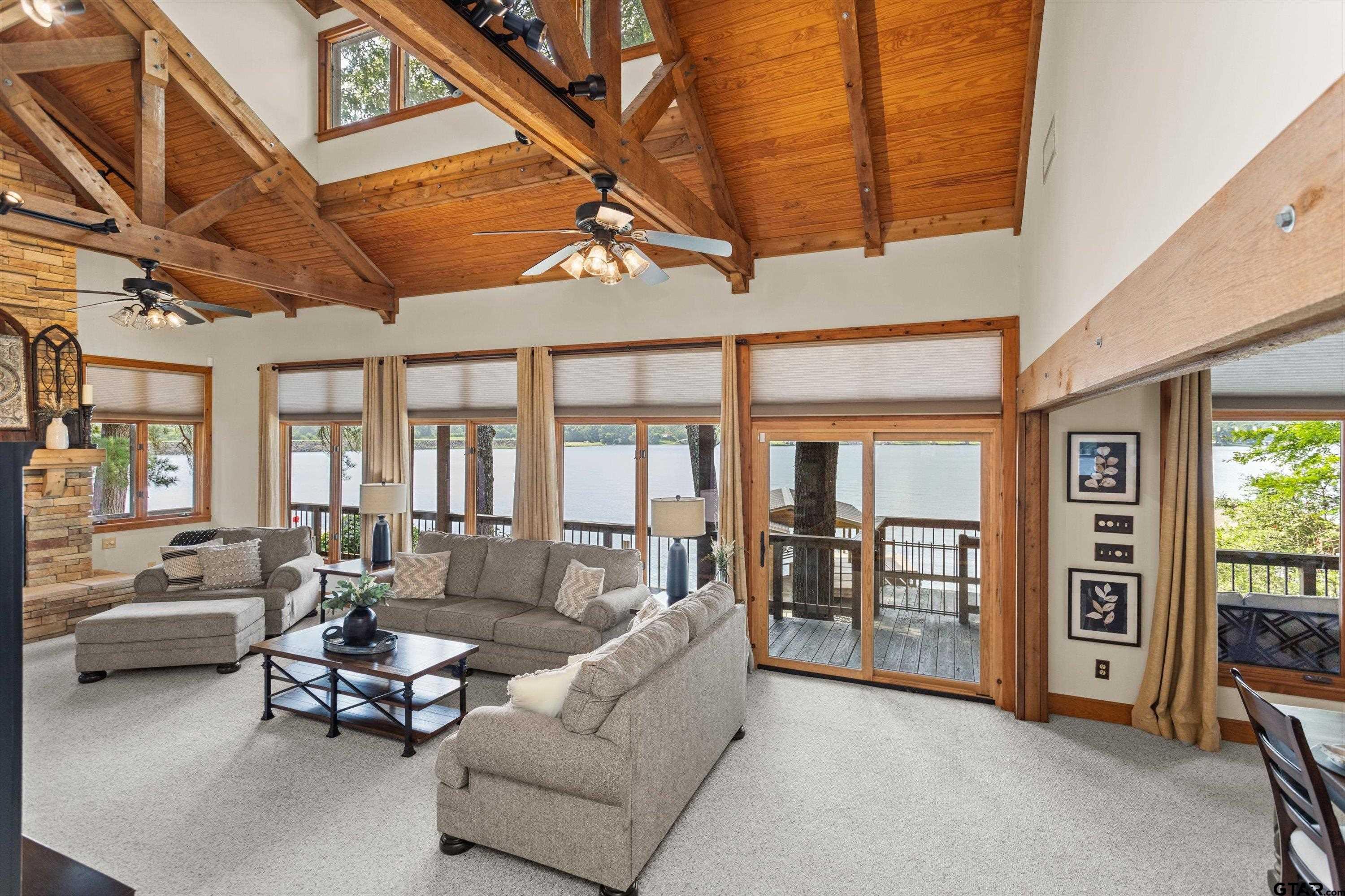 129 Tejas Trail Grapeland, TX 75844 - Photo 9 of 47 a living room with furniture and large windows