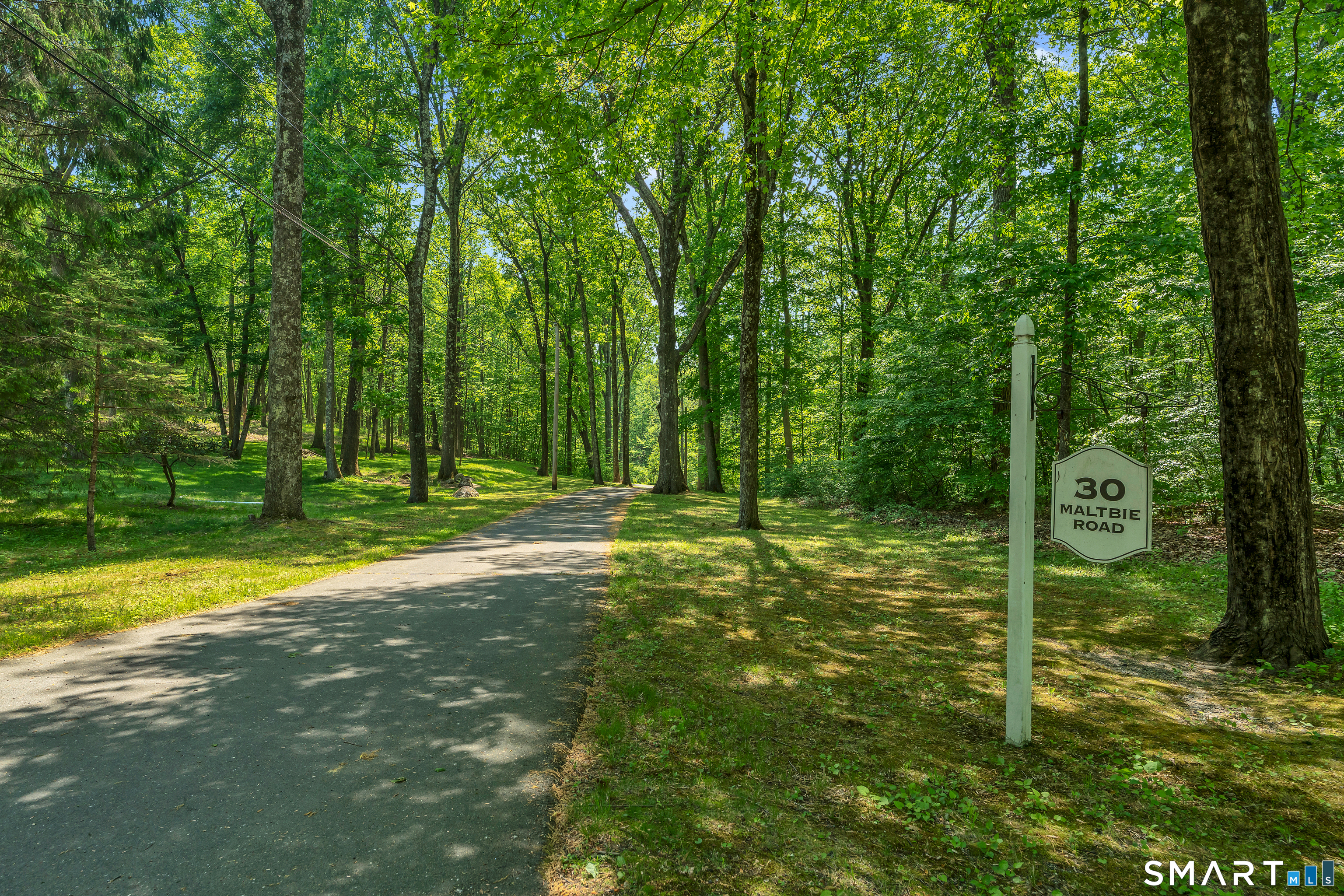 30 Maltbie Road Newtown, CT 06470 - Photo 2 of 40 a backyard of a house with swimming pool and trees