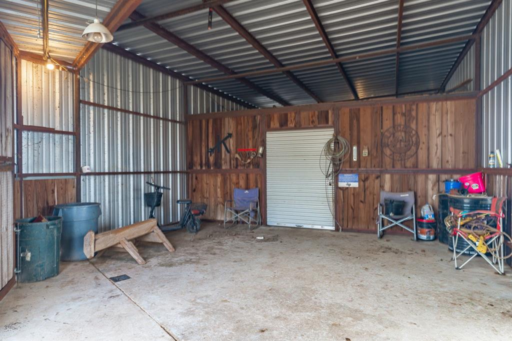 12194 Gholson Road Waco, TX 76705 - Photo 11 of 39 a view of an empty room with a wooden fence