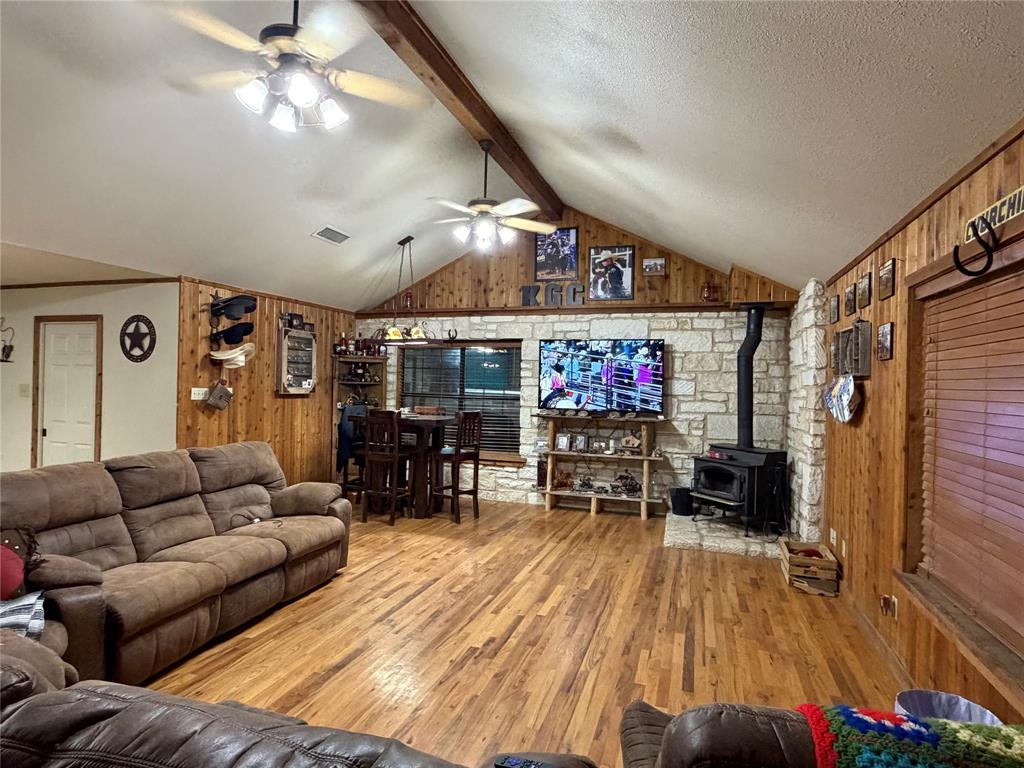 12194 Gholson Road Waco, TX 76705 - Photo 3 of 39 a living room with furniture and a flat screen tv