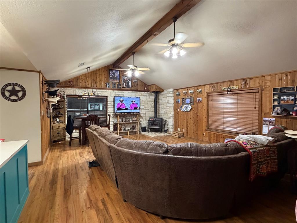 12194 Gholson Road Waco, TX 76705 - Photo 4 of 39 a living room with furniture and a flat screen tv