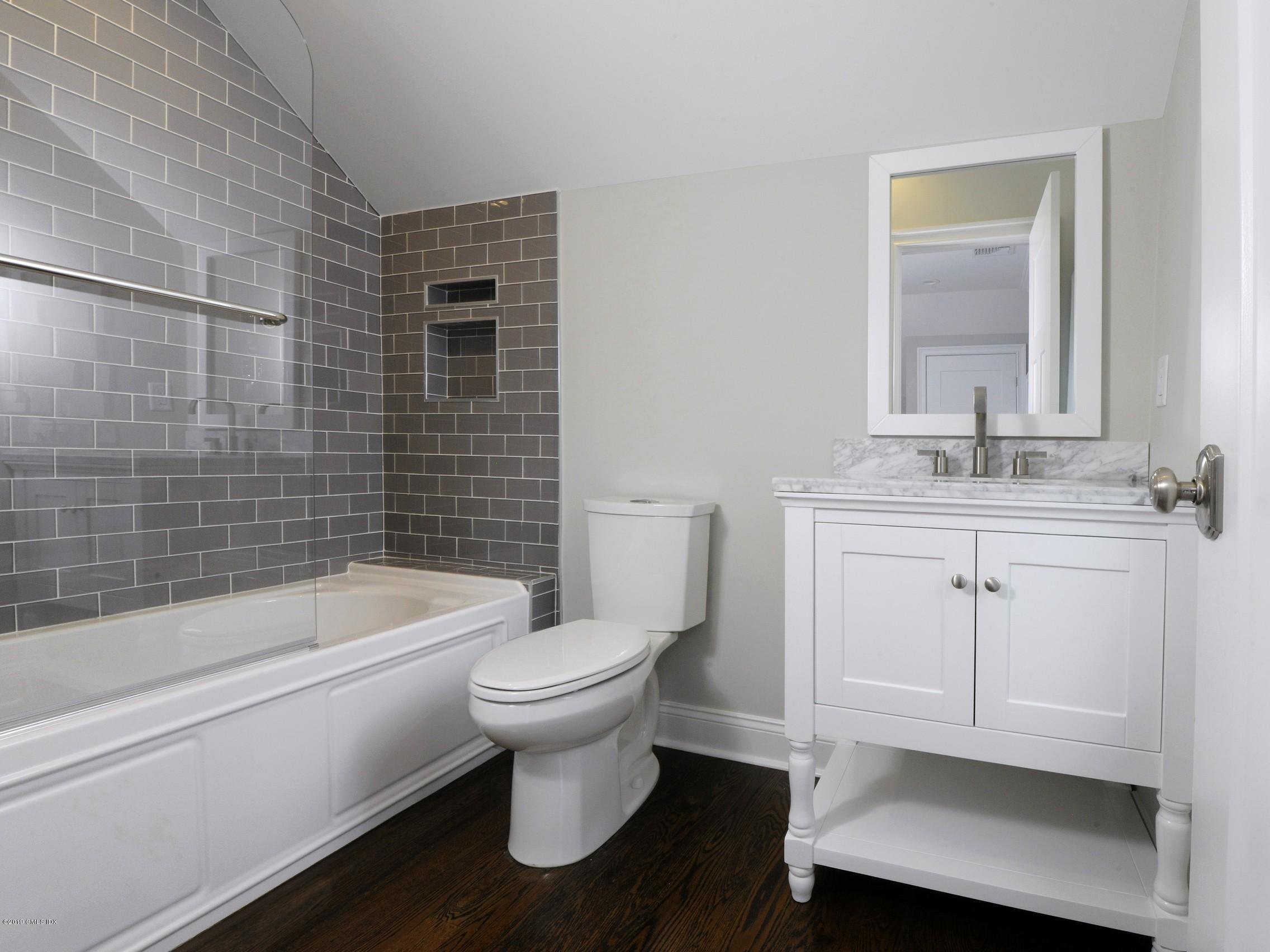 200 Davis Avenue Greenwich, CT 06830 - Photo 20 of 26 a bathroom with a sink toilet and shower