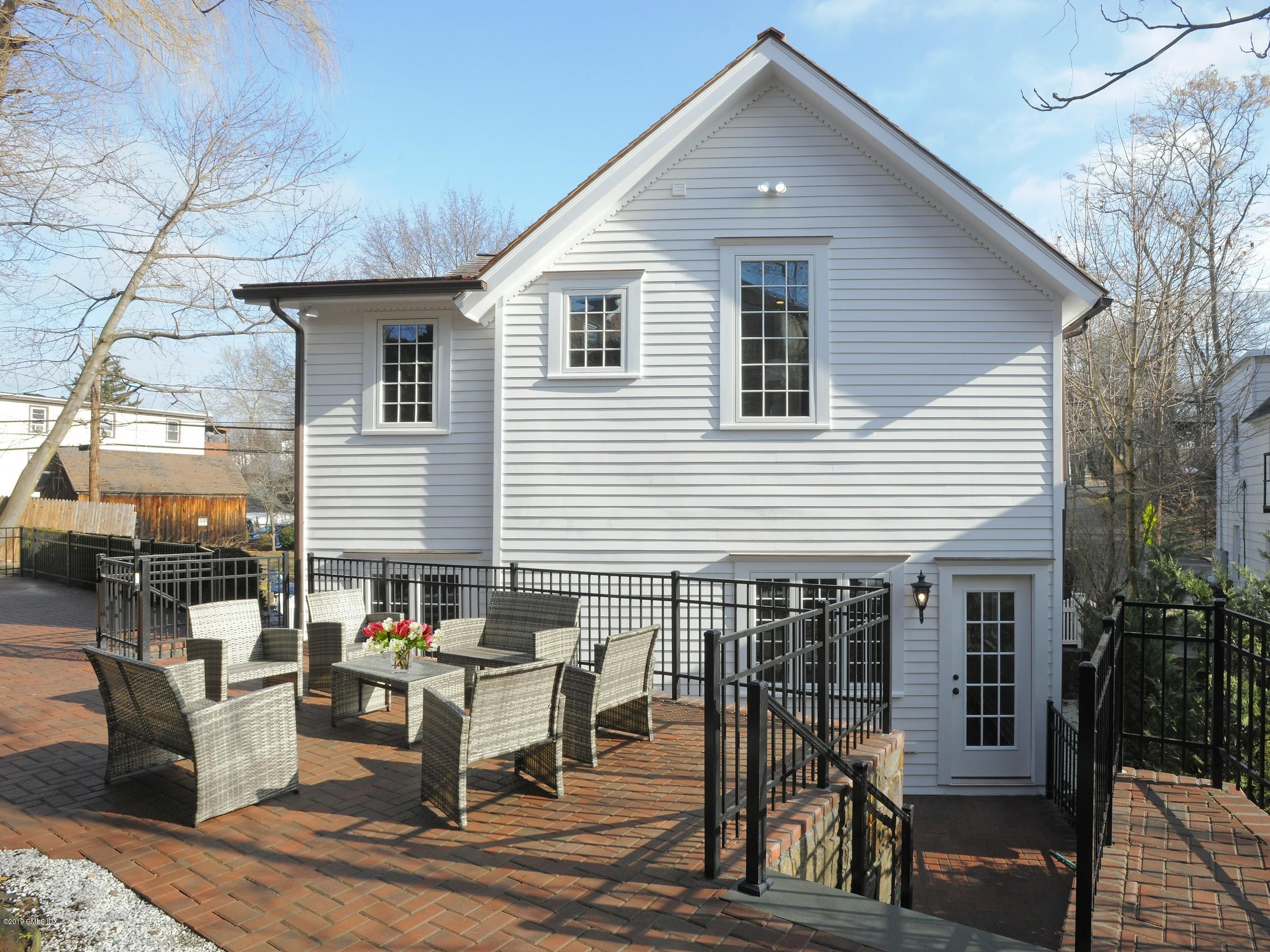 200 Davis Avenue Greenwich, CT 06830 - Photo 24 of 26 a view of a house and patio