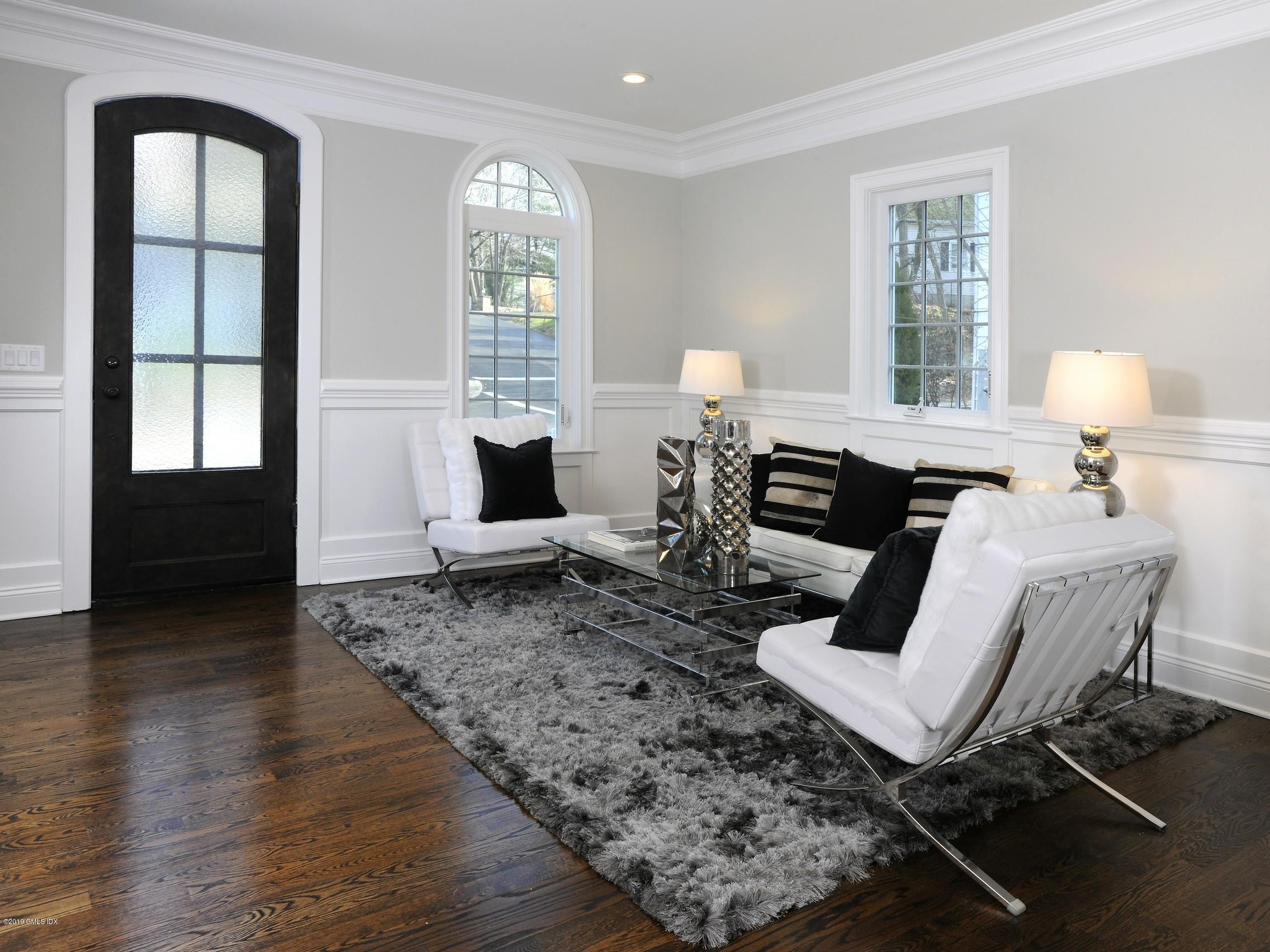 200 Davis Avenue Greenwich, CT 06830 - Photo 3 of 26 a living room with furniture and wooden floor