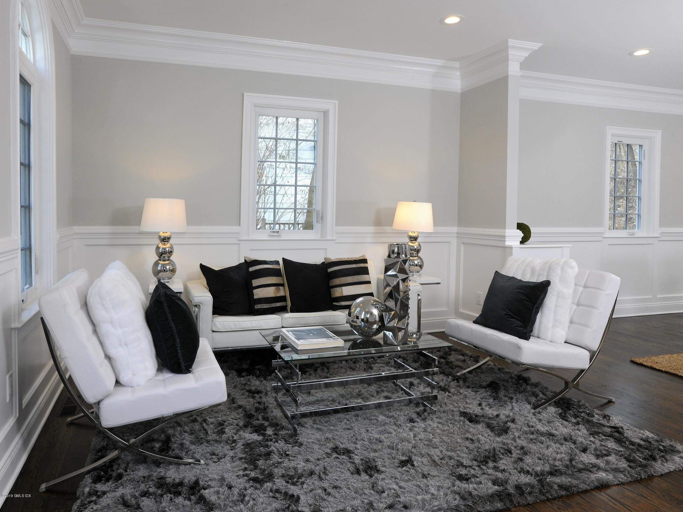 200 Davis Avenue Greenwich, CT 06830 - Photo 4 of 26 a living room with furniture and wooden floor