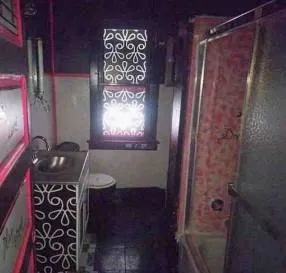 a bathroom with a shower and a mirror