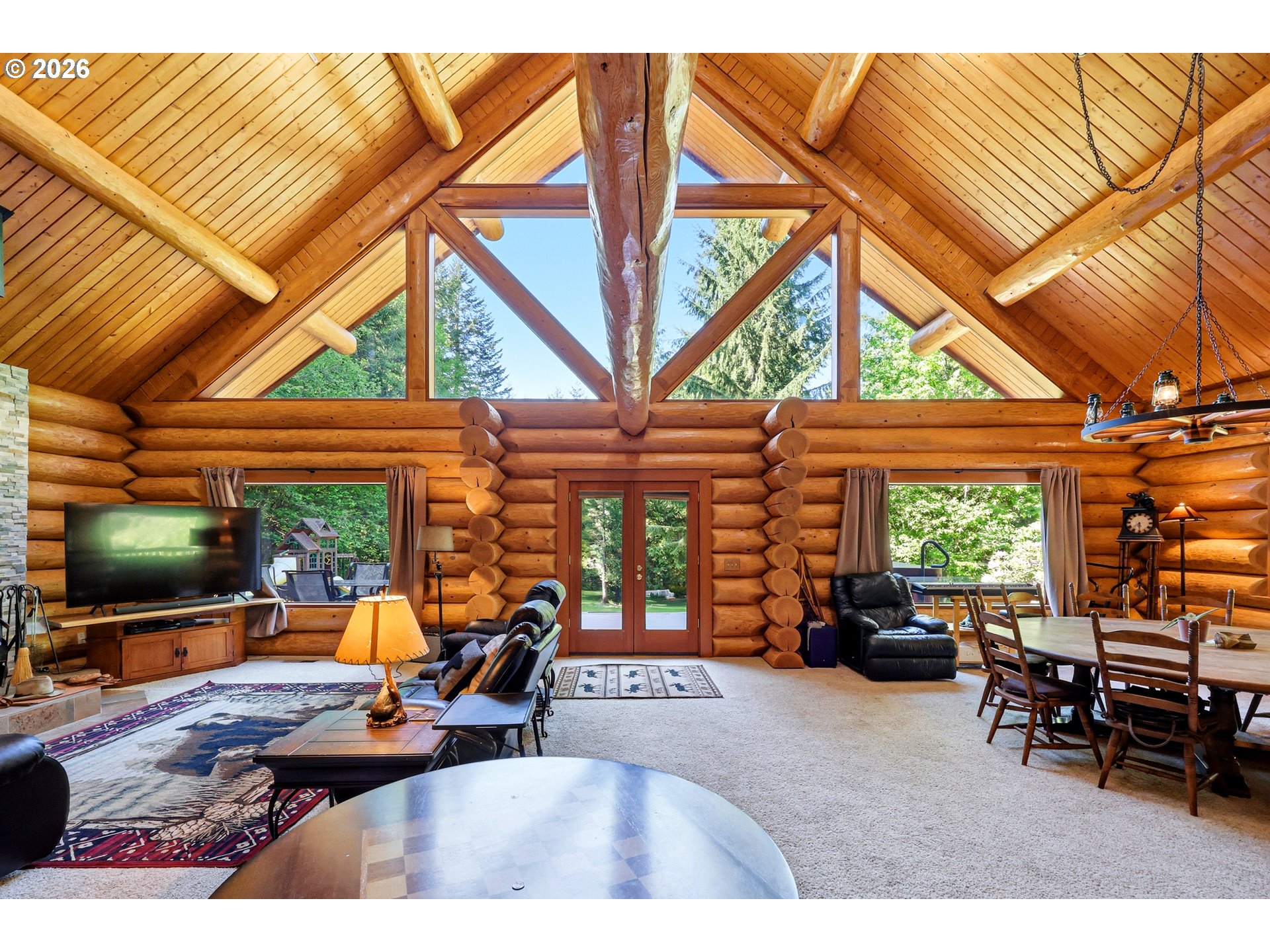 390 Spruce Creek Road Longview, WA 98632 - Photo 13 of 45 a outdoor living space with furniture and a flat screen tv