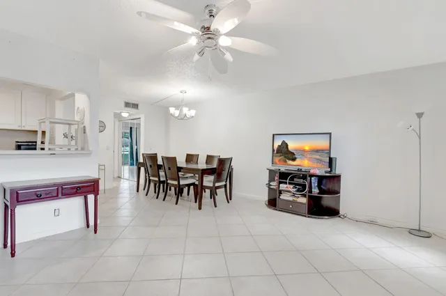 a view of kitchen with furniture and chandelier