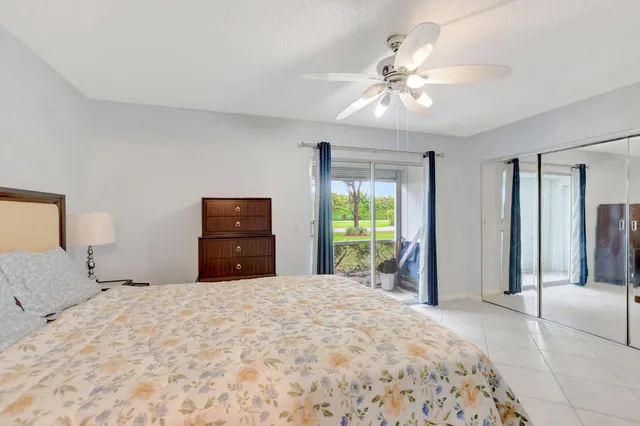 a bedroom with a bed and a tv