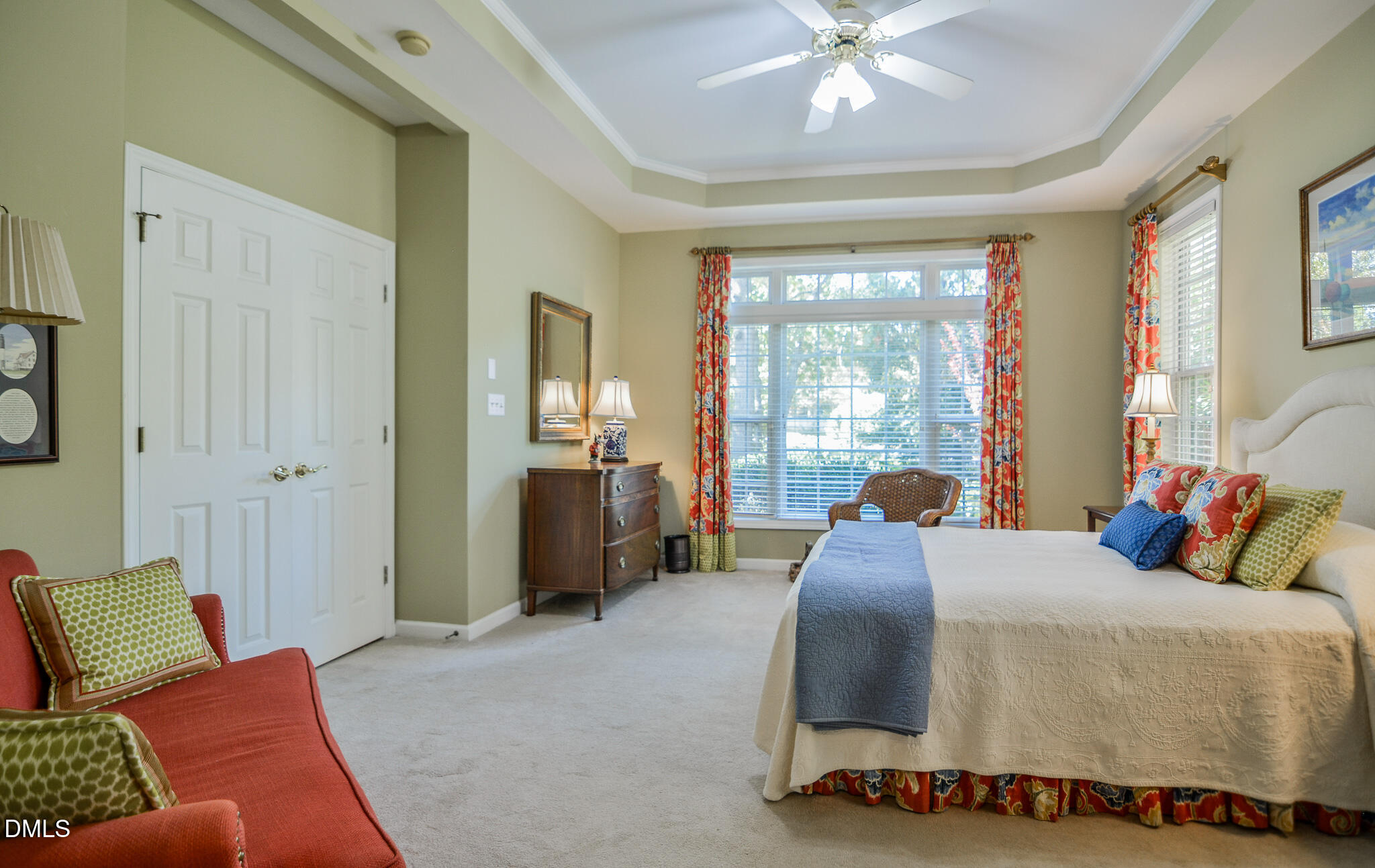 105 Trailing Oak Trail Clayton, NC 27527 - Photo 25 of 61 a bedroom with a bed and glass walk in closet