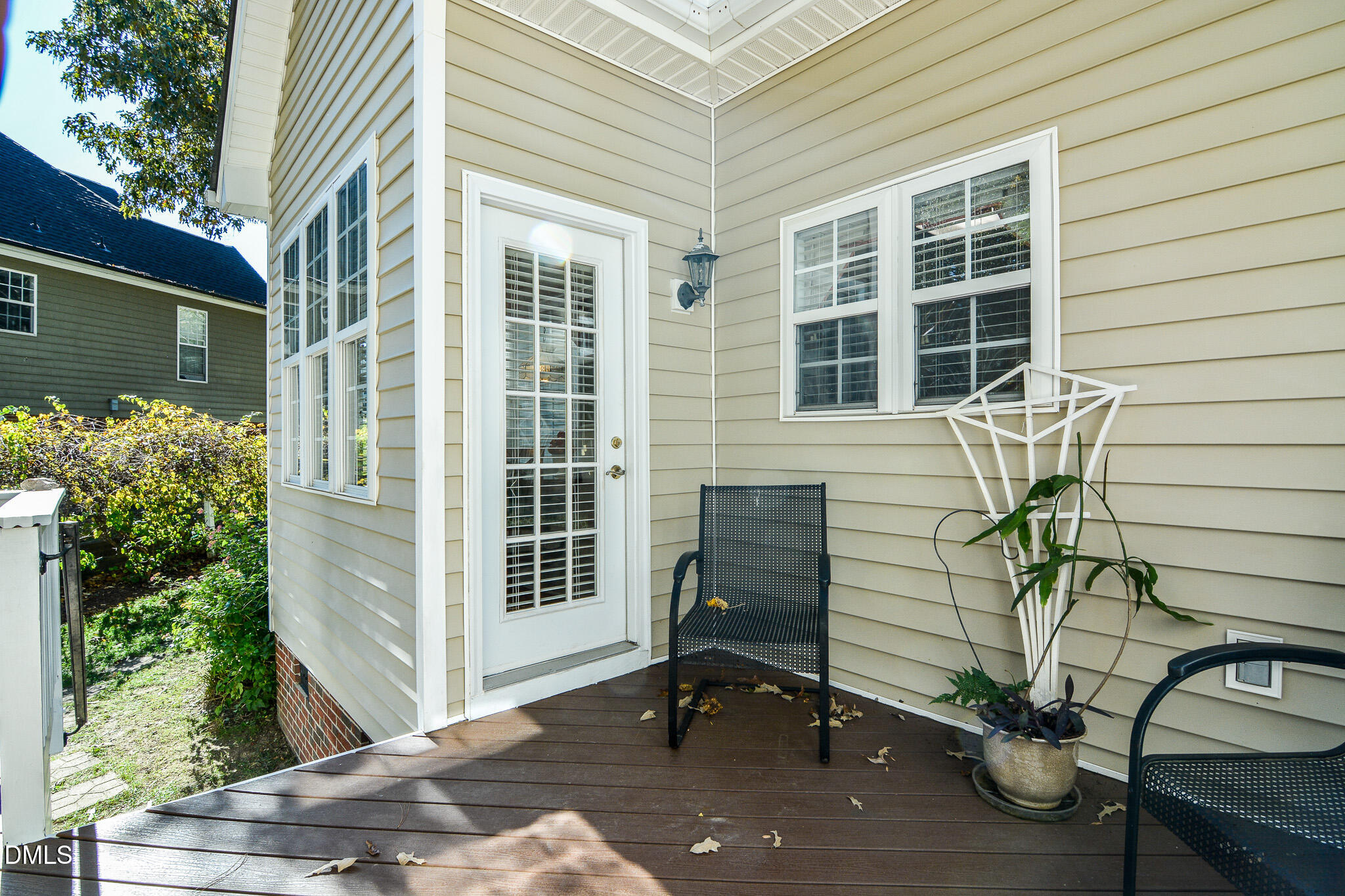 105 Trailing Oak Trail Clayton, NC 27527 - Photo 47 of 61 a view of a chair and table in the backyard of the house