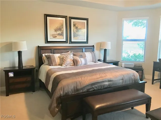 a bedroom with a bed and window